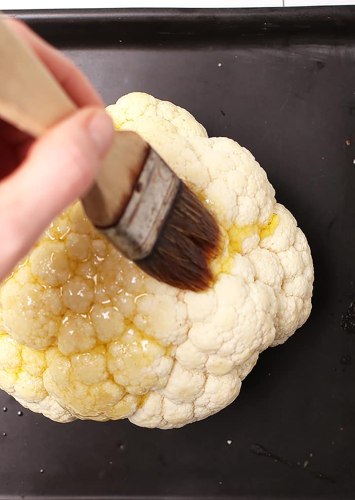 Oil brushed onto head of cauliflower