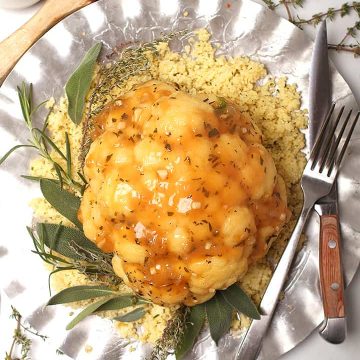 Whole Roasted Cauliflower on silver platter