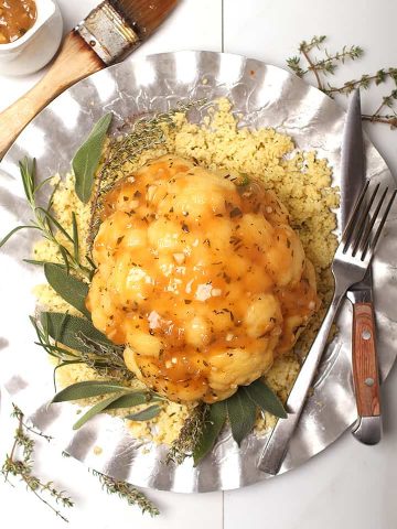 Whole Roasted Cauliflower on silver platter