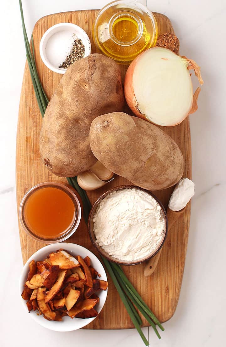 Potatoes, onions, and coconut bacon on cutting board