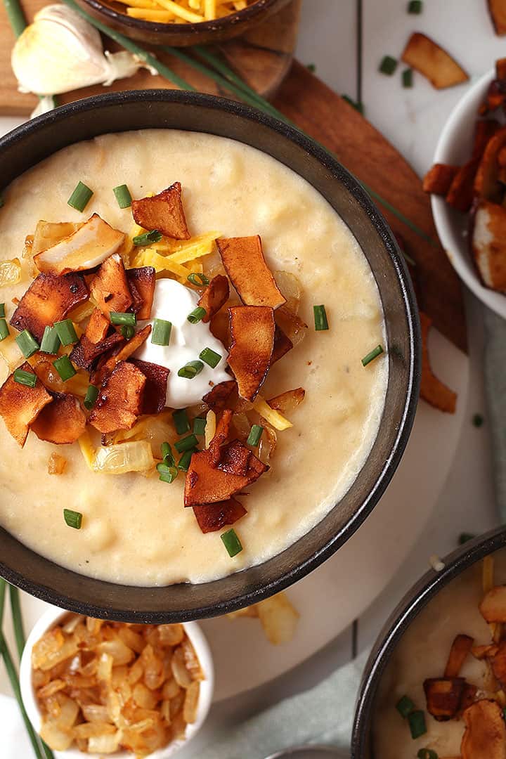Bowl of vegan potato soup with coconut bacon