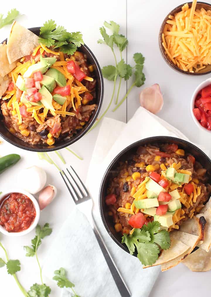 Two vegan burrito bowls on white background