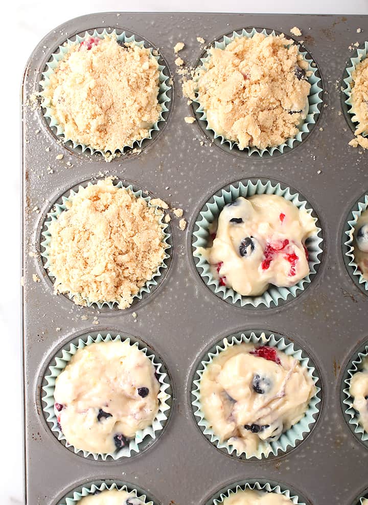 Raw batter in a muffin tin