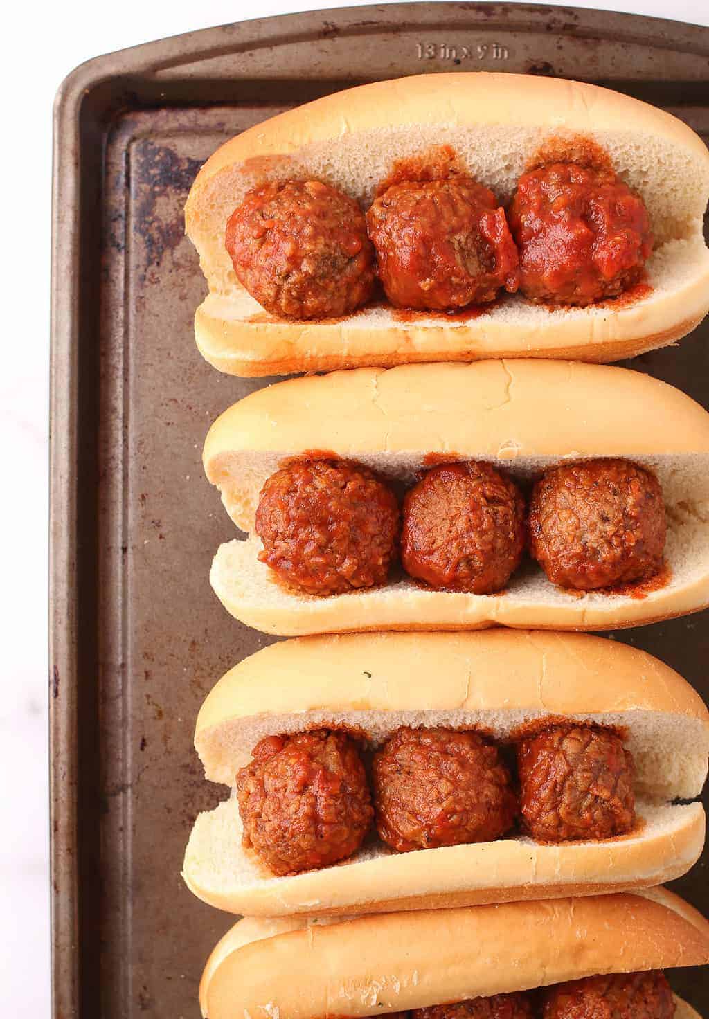 Hoagie rolls filled with meatballs