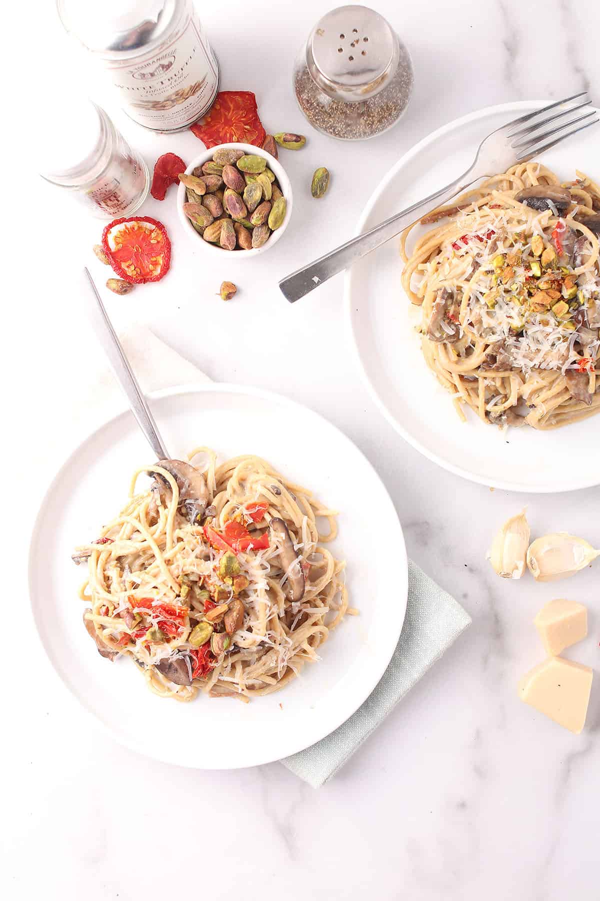 Truffle pasta on two white plates