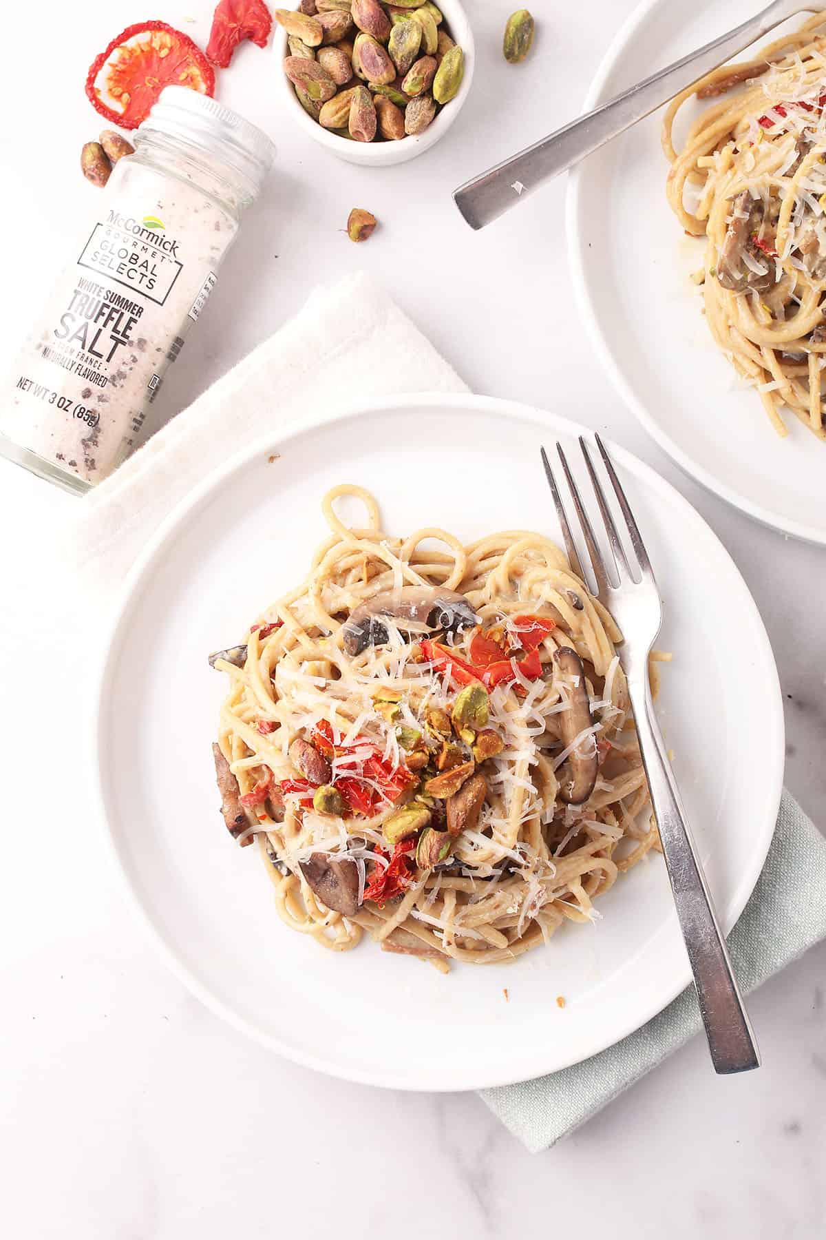 Pasta dish on white plate with fork