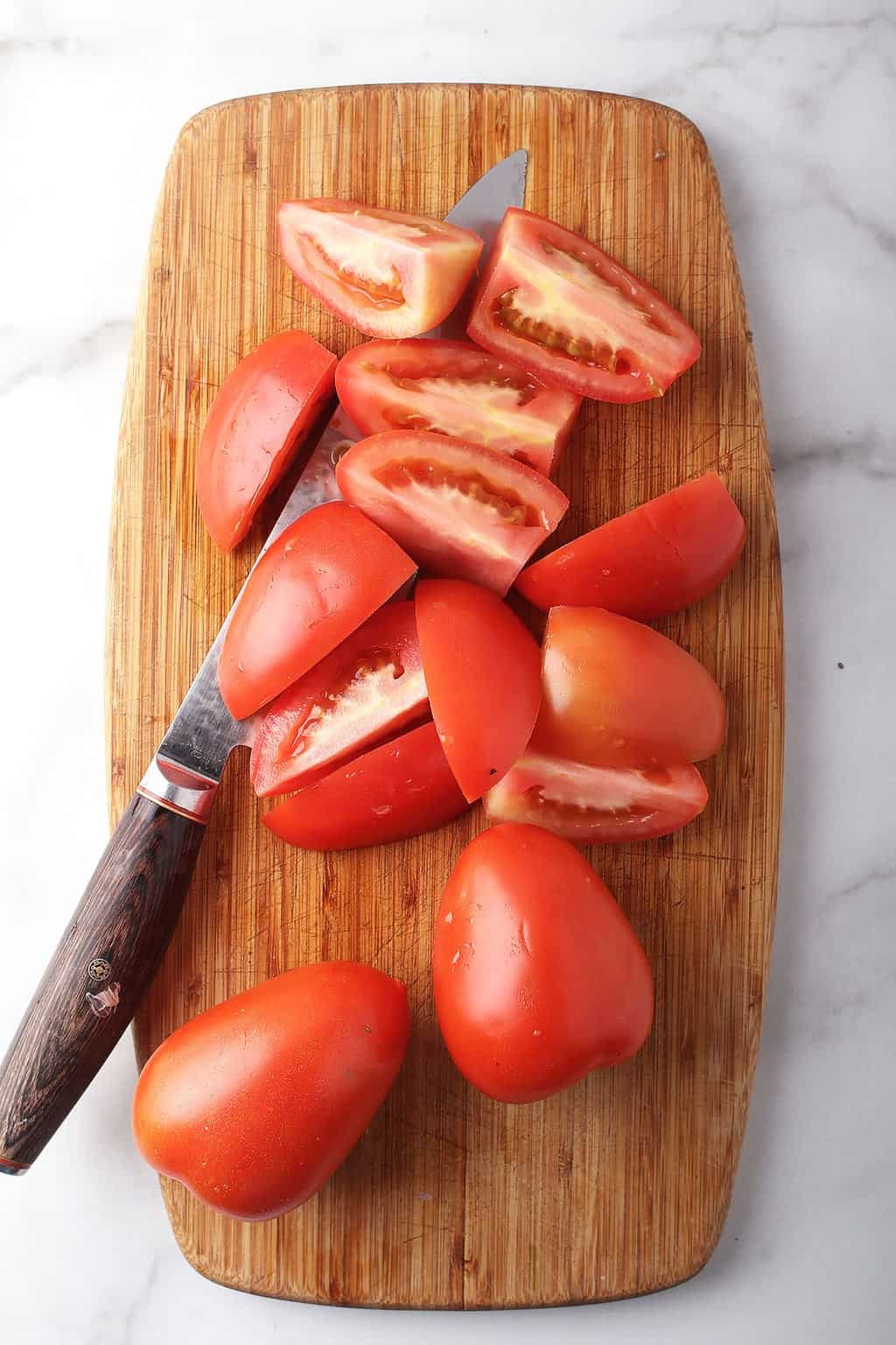 Roma tomatoes cut into quarters