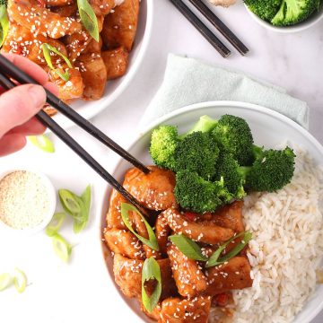 Finished recipe on a white plate with chopsticks