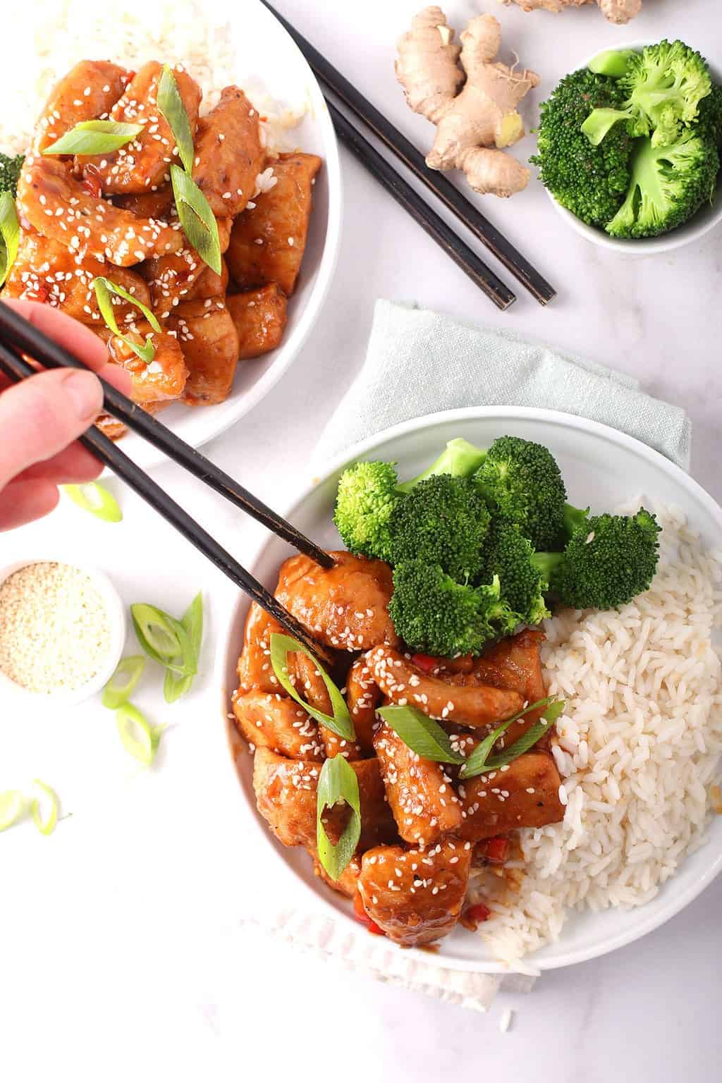 Finished recipe on a white plate with chopsticks