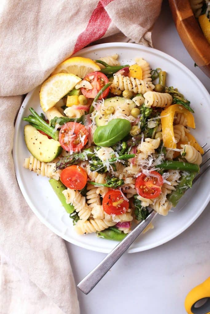 Vegan pasta on a white plate with a fork