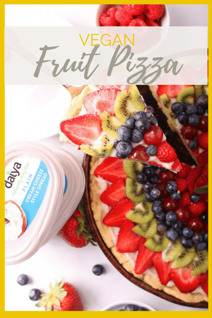 Vegan Fruit Pizza! It is made with a buttery, melt-in-your-mouth sugar cookie crust, topped with sweet cream cheese filling, and finished with fresh fruit for the perfect summertime dessert.