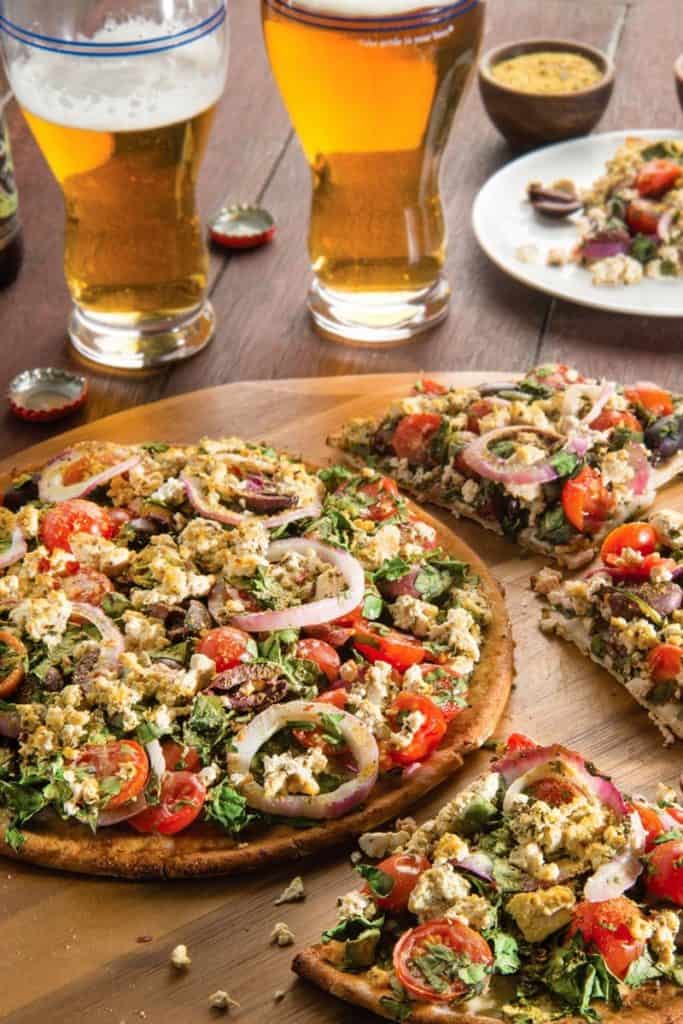 Greek Style Pizza on a wooden board