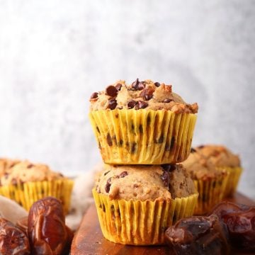 Two finished muffins stacked on top of one another