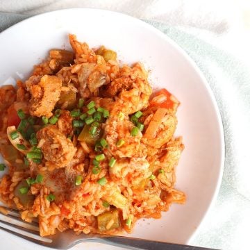 Finished dish on a white plate with a fork