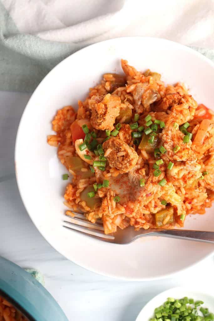 Finished dish on a white plate with a fork