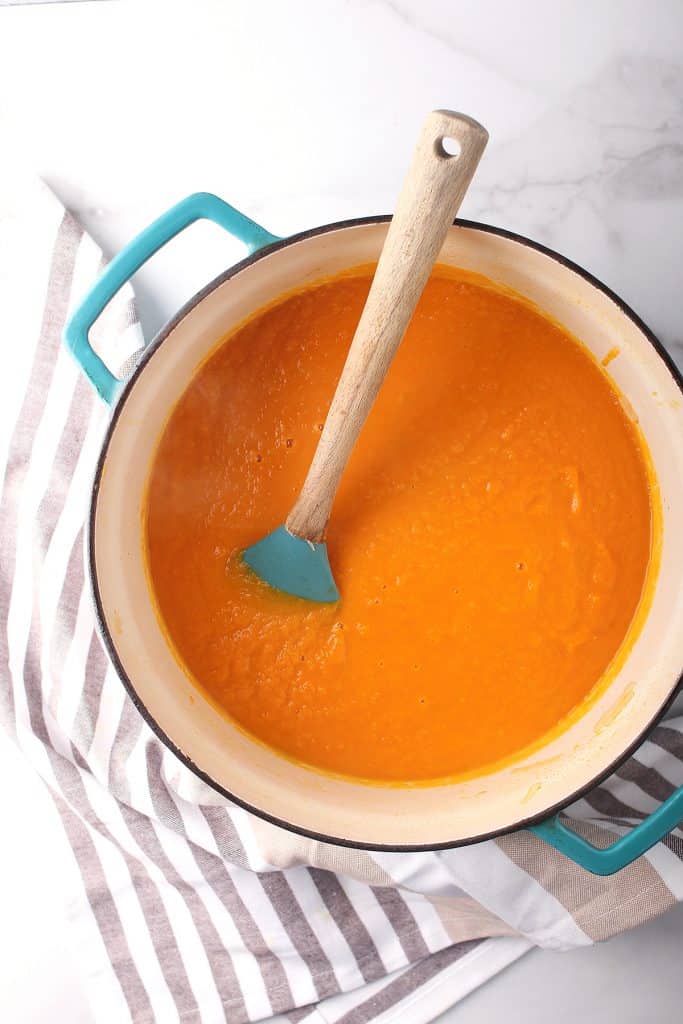 Puréed carrot soup in a large soup pot