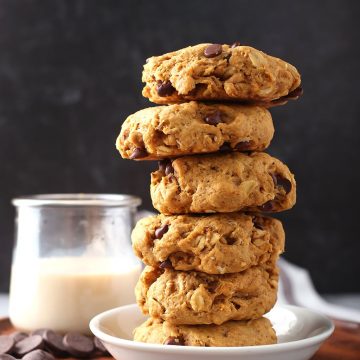 Stack of finished cookies next to a glass of milk