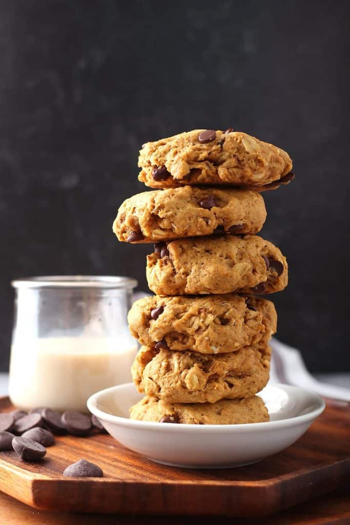 Stack of finished cookies next to a glass of milk