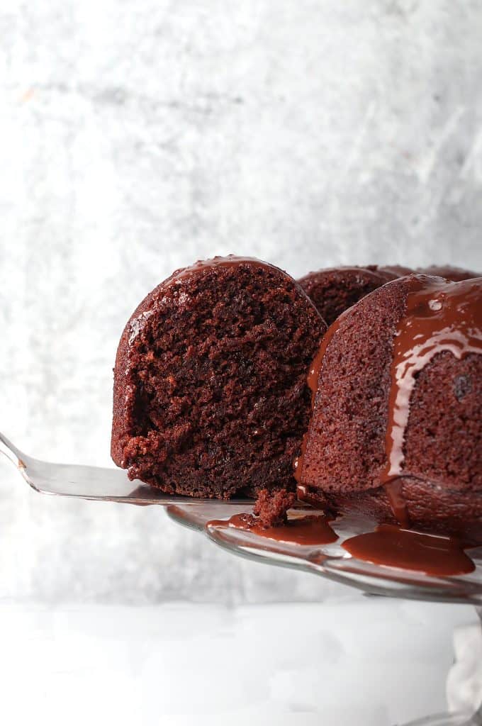 Slice of vegan bundt cake on an offset spatula