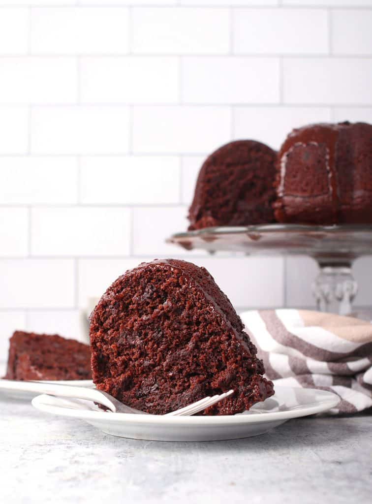 Slice of vegan bundt cake on a white plate