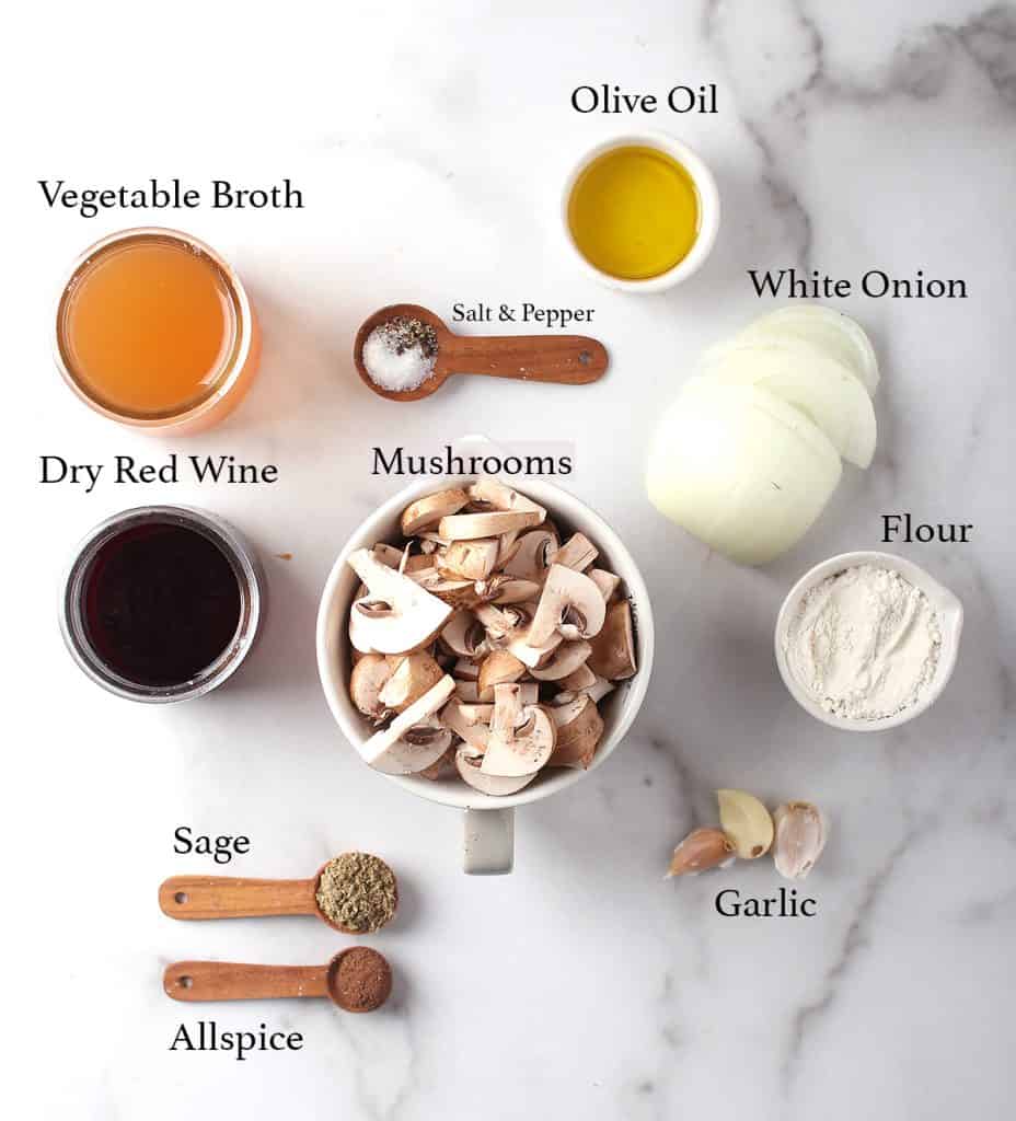 Ingredients for mushroom gravy on a marble countertop
