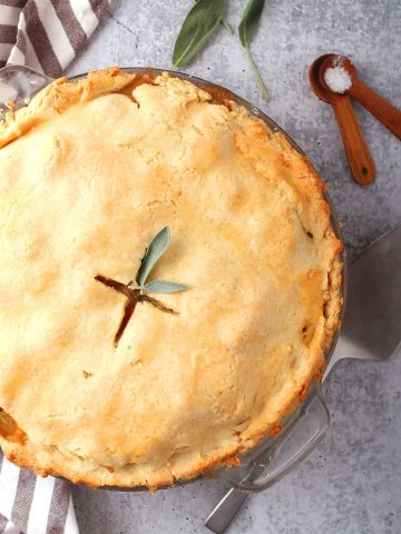 Whole finished pot pie with fresh sage