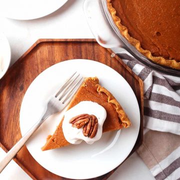 Slice of finished pie on a white plate with a fork