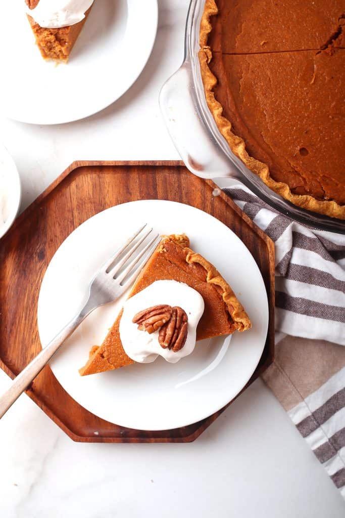 Slice of finished pie on a white plate with a fork