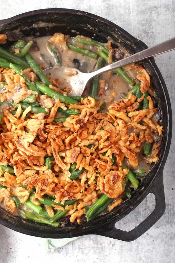 Finished green bean casserole in a cast iron skillet