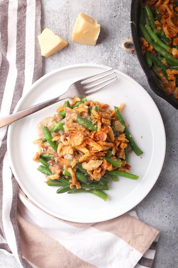 Finished green bean casserole on a white plate