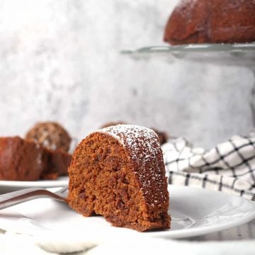 Slice of finished gingerbread cake on a white plate