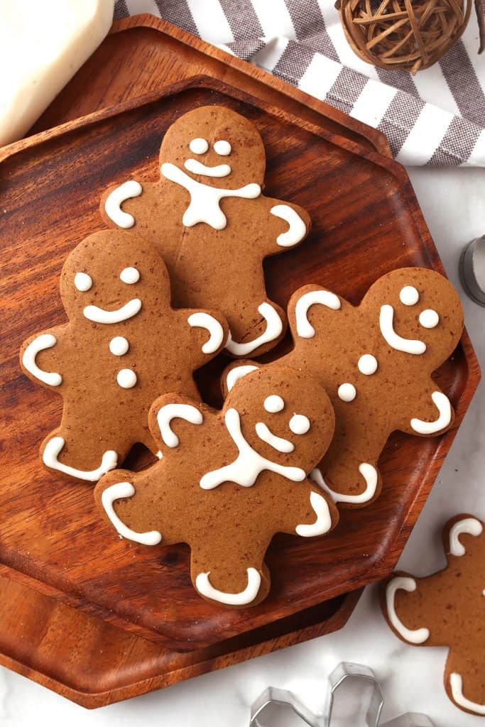 Finished gingerbread cookies on a wooden platter