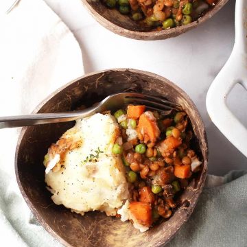 Two servings of shepherd's pie served in two bowls.