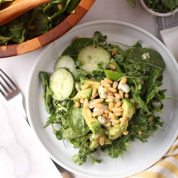 Finished salad on a white plate with a fork