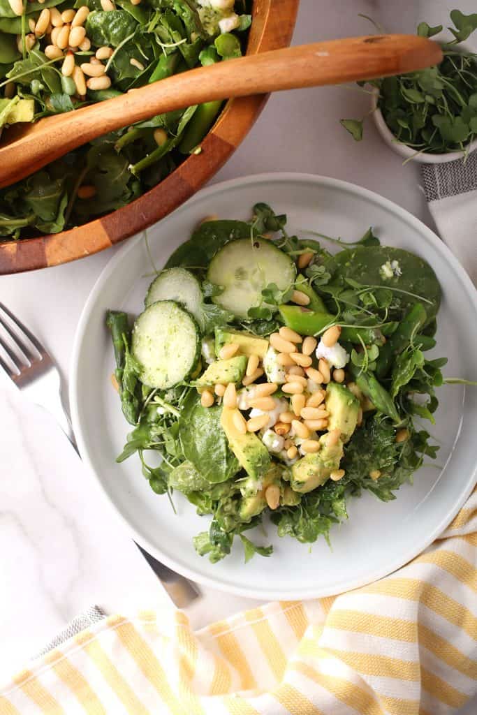 Finished salad on a white plate with a fork