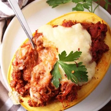 Finished stuffed spaghetti squash with a fork