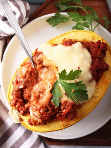 Finished stuffed spaghetti squash with a fork