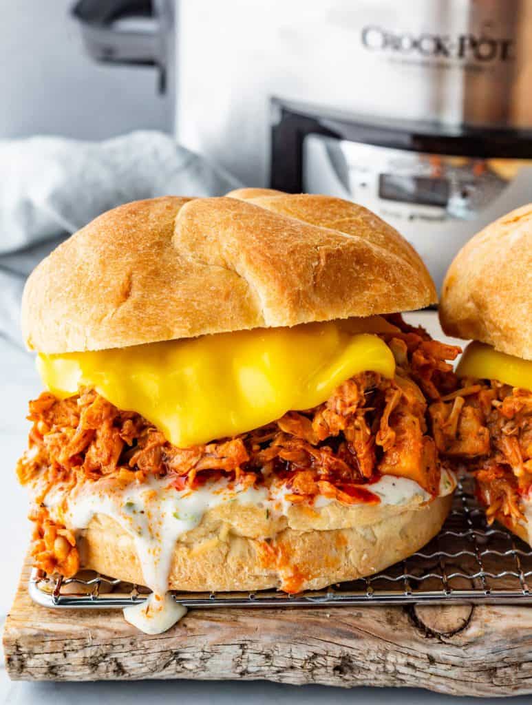 BBQ Jackfruit Sandwich with melted vegan cheese on a wire cooling rack