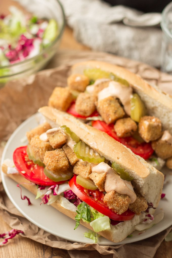 Two Po Boy Sandwiches on a white plate