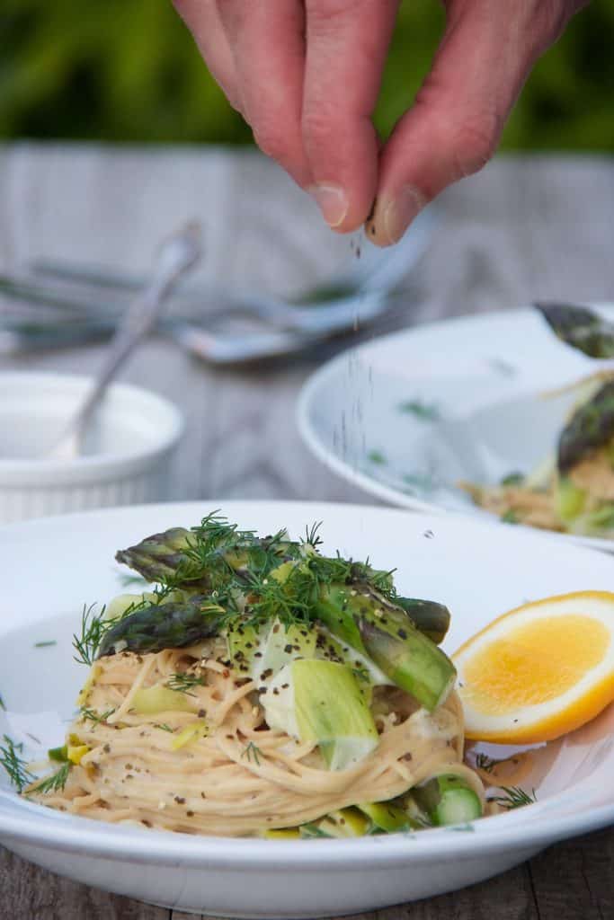 Creamy Leek and Asparagus Pasta in a white bowl