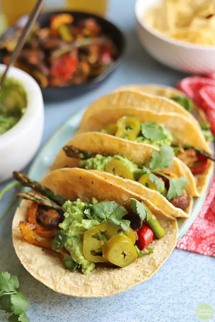 Asparagus and mushroom fajitas in corn tortillas