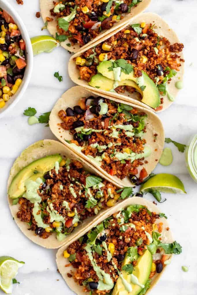 Vegan Tofu tacos in white corn tortillas with avocado and cilantro