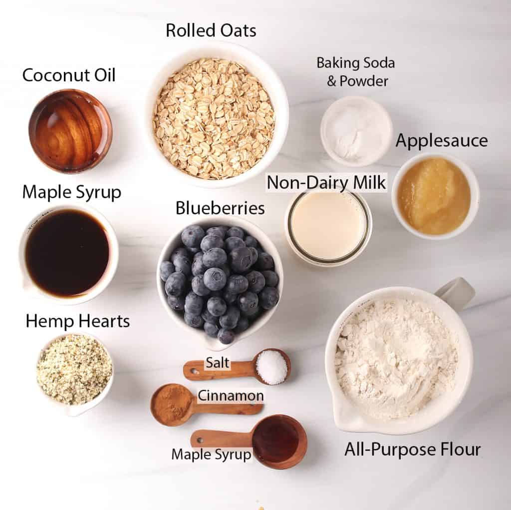 ingredients for healthy blueberry muffin recipe laid out on a white table