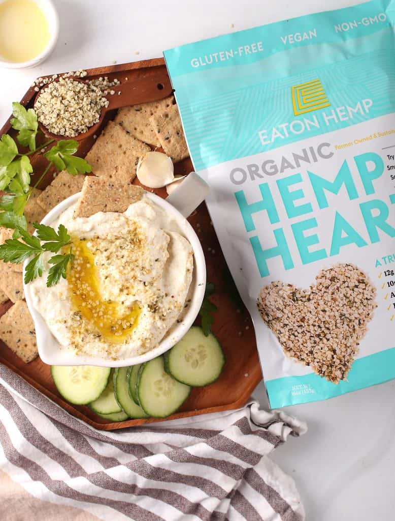 hemp cauliflower hummus (keto) served with olive oil, crackers, Eaton hemp, parsley, garlic and cucumbers