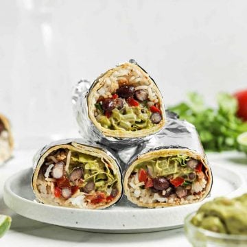 three burritos on white plate