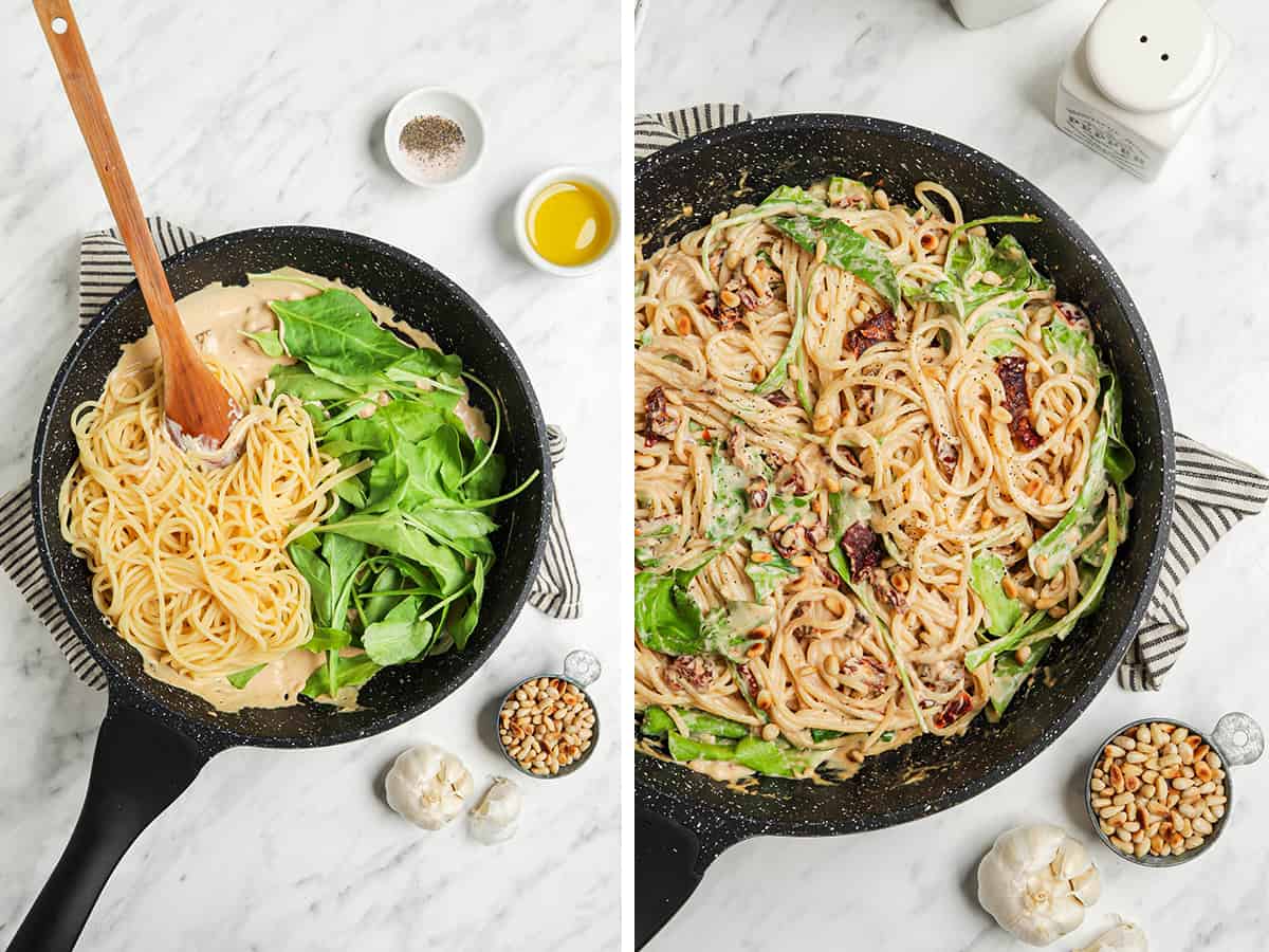 one pan with pasta and hummus sauce with arugula