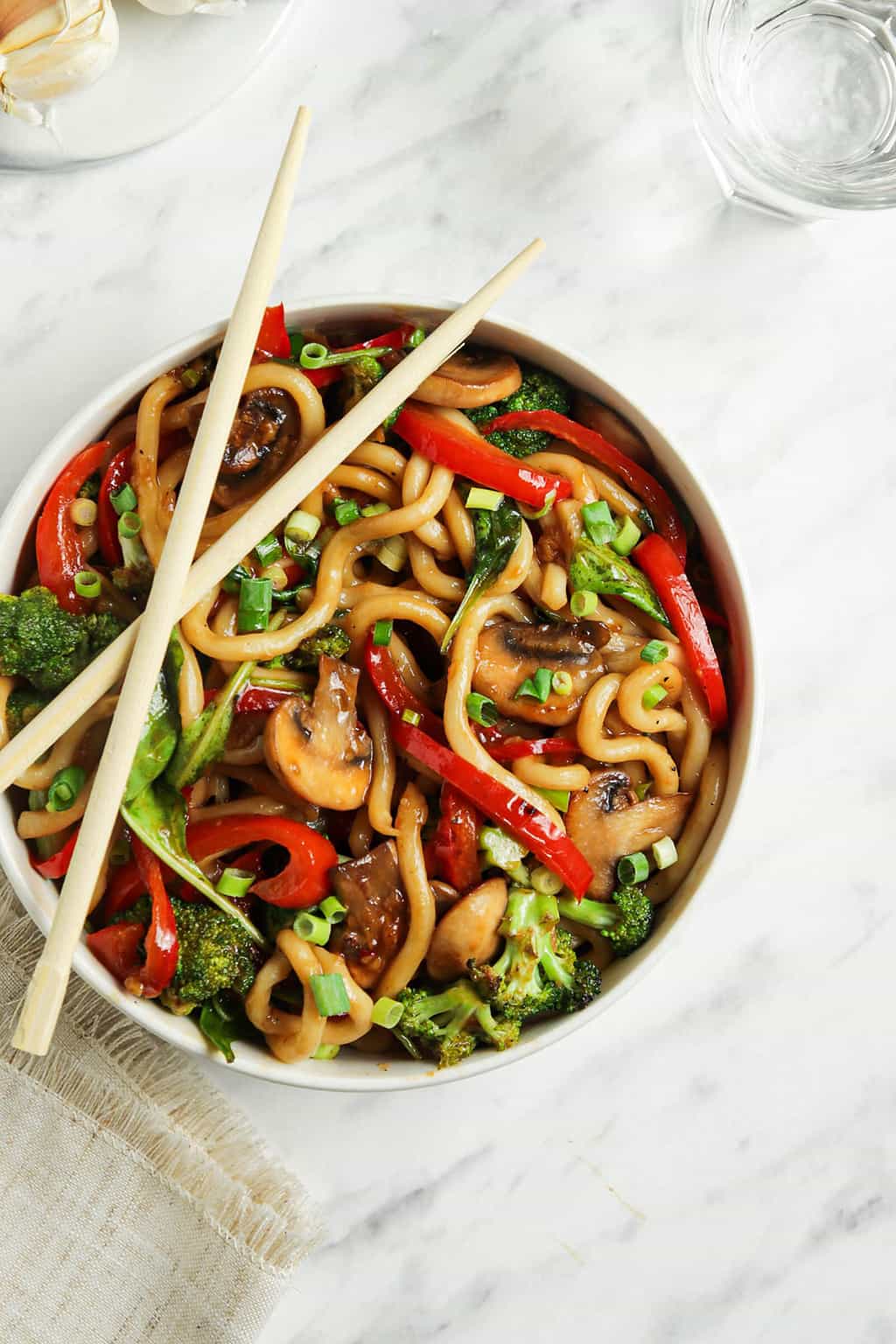 vegan yaki udon in bowl with chopsticks