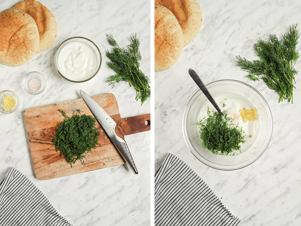 chopped resh dill on cutting board with knife then added to bowl with yogurt and garlic