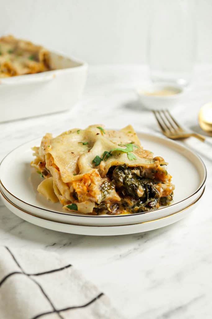 one slice of vegan butternut squash lasagna with kale 