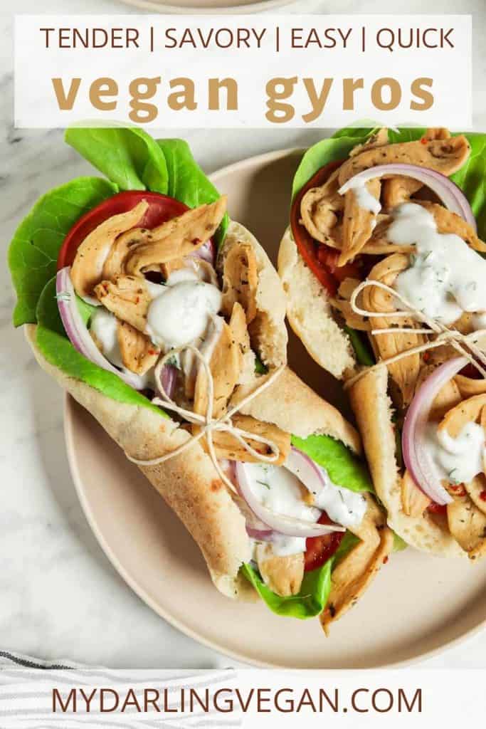 two vegan gyros on plate with lettuce and tzatziki sauce